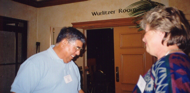 Robert Martinez sells raffle tickets to an unidentified conference attendee